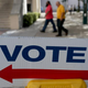 A sign points to the early-voting station set up at the Government Building Oct. 28, 2014, in Miami.
Joe Raedle/Getty Images